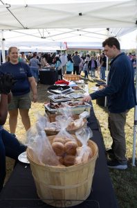 RH Events & Catering serving guests at an outdoor catered event buffet