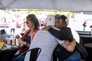 company employees interacting with each other during a corporate event