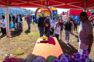 Kids playing midway game at company family fun day