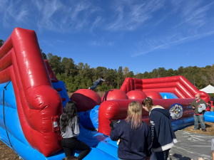 Inflatable obstacle course at a company picnic